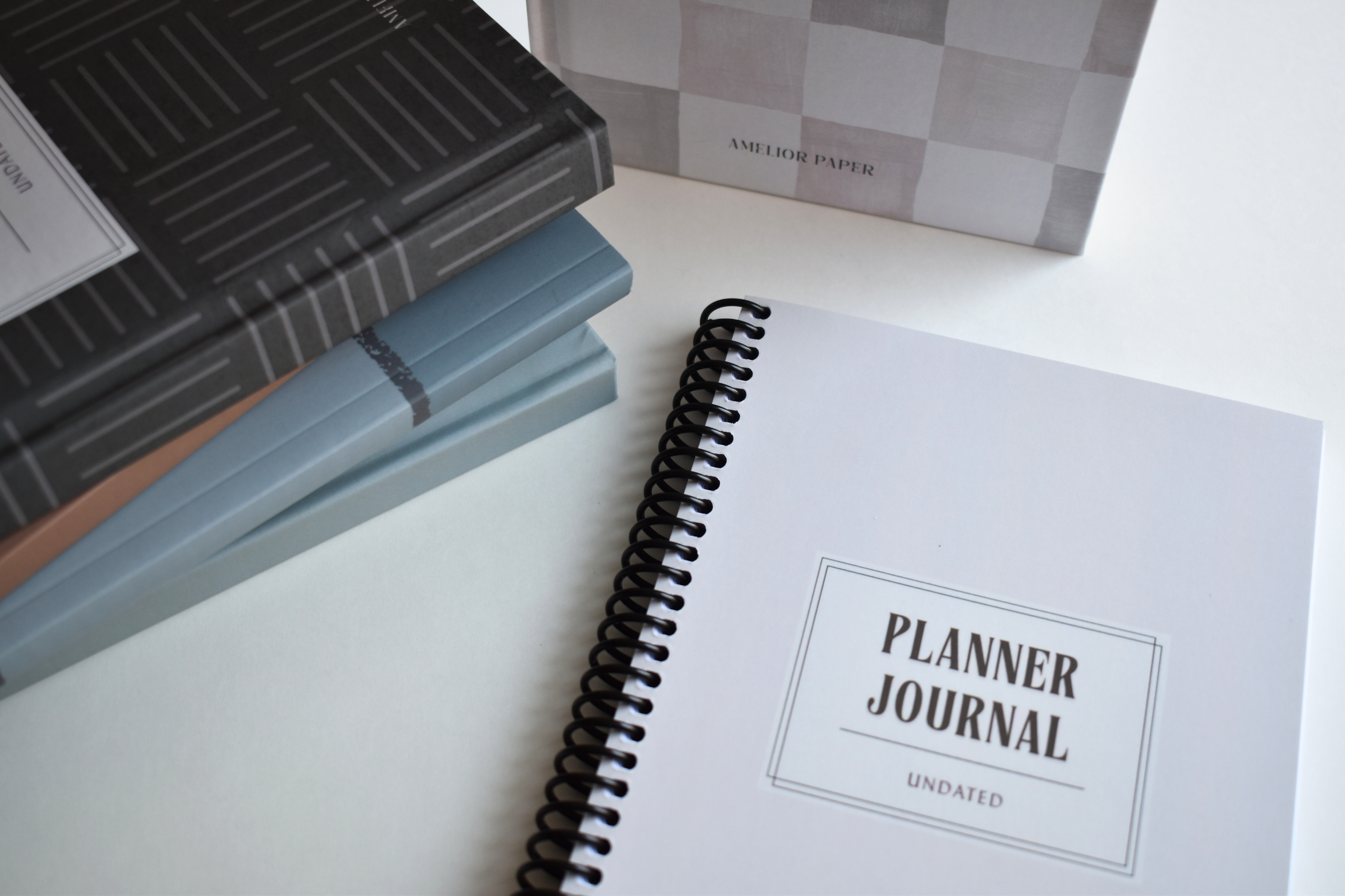 Collection of custom planners and journals on a white surface